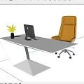 Modern Silver Office Desk Setup With Laptop Black Mug Yellow Plant And Brown Leather Chair