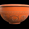 Orange Ceramic Bowl With Ancient Figural Carvings And Decorative Patterns As Household Item