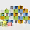 Colorful Storage Shelves With Books And Toys In Kids Playroom Area