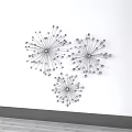 Modern Minimalist Metal Wall Decor With Three Radiant Spiral Pieces on White Wall