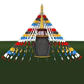Tower Shaped Landscape Sculpture Featuring Golden Top Colorful Flags Sunset Sky Green Grass And Trees