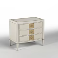 Modern Light Colored Nightstand With Three Drawers And Gold Handles Trim