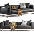 Black Leather Two Seater Sofa With Colorful Blanket Pillows And Metal Frame