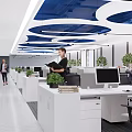 Modern Public Open Office Space With White Desks Computer Monitors Green Plants And Blue Ceiling