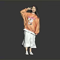 Woman In Orange Sweatshirt With Cartoon Graphic White Skirt Making Heart Gesture On Gray Background