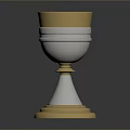 Elegant Gold And Silver Decorative Cup With Intricate Engraved Patterns And Sturdy Base