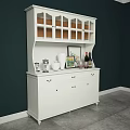 White Decorative Cabinet With Glass Doors Drawers And Vase Wine Bottles On Dark Green Wall