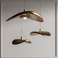 Three Modern Curved Bronze Pendant Lights With Metallic Finish For Interior Decor
