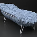 Blue Fabric Chaise Lounge With Puffy Cushions And White Metal Legs
