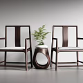Modern Dark Wood Armchairs With Light Seats And Round Table With Green Plant