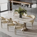 Modern Dining Table Set with Marble Top Beige Chairs and Green Plant in Bright Kitchen