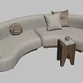 Curved Beige Plush Sectional Sofa With Pillows And Wooden Side Table