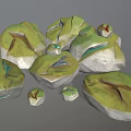 Green And White Decorative Stone Pieces With Colorful Lines And Small Ornaments