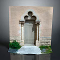 Beige Wall Arched Entrance Gate With Wooden Door Stone Pillar Decorations And Green Plants Path