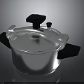 Modern Silver Pressure Cooker Kitchen Appliance With Black Handles And Knob