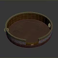 Traditional Circular Decorative Container With Ornate Patterns And Colorful Borders