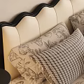 Double Bed With Black Scalloped Headboard Plaid Pillows Floral Bedspread Nightstands And Decorative Wall Art