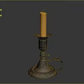 Vintage Candlestick Holder With Lit Yellow Candle And Ornate Design