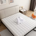 Cozy Double Bed With Quilted Mattress Nightstand Lamp And Wall Art In Bedroom