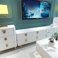 Modern White TV Stand With Gold Accents Table Lamps And Wall Mounted TV