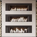 Modern Three Tiered Fireplace With Lit White Candles And Wood Log Decor