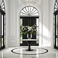 Stylish Entryway With Black Door Marble Vase And White Green Flower Arrangement On Round Table