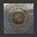 Manhole Cover On Stone Pavement With Fallen Leaves And Green Plants