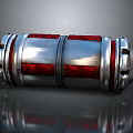 Shiny Metallic Cylindrical Tech Component With Red Panels And Silver Rings