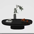 Modern Black Round Coffee Table With Green Plant Vase Oranges Book And Plate