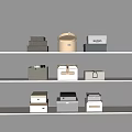 Home Storage Boxes in Various Colors and Textures on White Shelves for Organizing Home Supplies