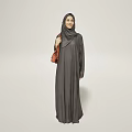 Woman In Gray Abaya With Hijab Holding Red Handbag Against Light Background