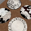 Round Area Rugs With Various Floral And Leaf Patterns On Wooden Floor 3d model