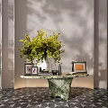 Elegant Console Table With Green Foliage Vase Photo Frames And Marble Pedestal