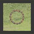 Stone Circle Made Of Gray And Brown Stones Placed On Green Grass