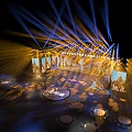 Modern Stage Setup With Illuminated Lighting Steps Backdrop Displays And Front Table