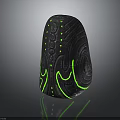 Black Stone Sculpture With Intricate Glowing Green Pattern And Decorative Design