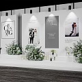 Elegant Wedding Stage Decor With Floral Arrangements And Photo Posters