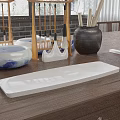 Stylish Jewelry Display On Wooden Table With Bamboo Stand And White Trays