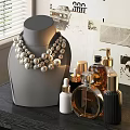Luxury Pearl Necklace Display on Gray Mannequin With Stylish Perfume Bottles for Elegant Jewelry Showcase