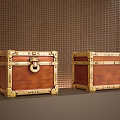 Two Brown Trunks with Gold Metal Latches and Decorations against Grid-Patterned Brown Wall 3d model