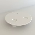 White Round Coffee Table With Three Circular Holes And Minimalist Modern Style
