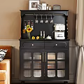 Black Sideboard With Glass Doors Displaying Sunflower Bouquet Coffee Maker And Spice Jars In Home