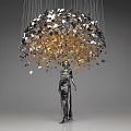 Art Installation Featuring Umbrella Shaped Structure With Hanging Colorful Circular Pieces And Human Figure