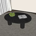 Round Black Wooden Coffee Table With Green Apples Bowl and White Book On Gray Rug