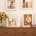 Decorative Photo Frames With Sunflower Bouquet And Children Photos On Wall And Table