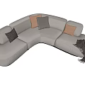 Modern Cream Curved Sectional Sofa With Brown Gray Pillows And Blanket