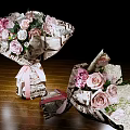 Beautiful Flower Bouquets With Pink Roses White Flowers Newspaper Wrapping Ribbon On Wooden Table