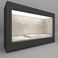 Black Display Cabinet with Glass Door Top Lighting Internal White Platforms and Brick Wall Background