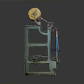 Vintage Industrial Machine With Yellow Cylindrical Rollers And Blue Green Metal Frame