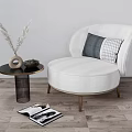 Cozy White Round Single Sofa With Decorative Pillows And Side Table On Wooden Floor